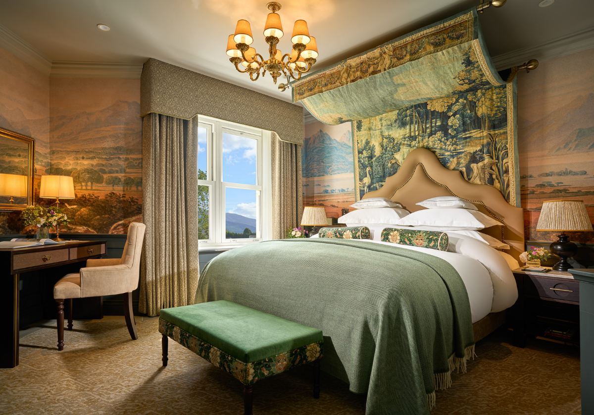 Elegant Garden Suite featuring Comfortable King Bed and seating with warm ambient lighting.