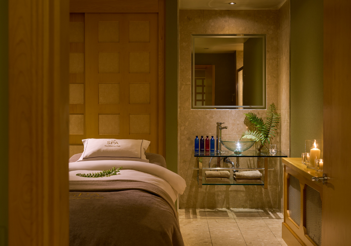 This is the Spa Room with a comfortable bed and products in the background.