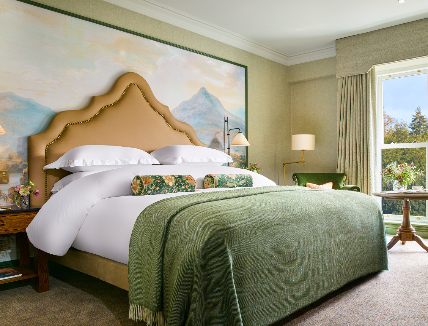 This is the Classic King Guest Room with the king-size bed and mural behind the bed.