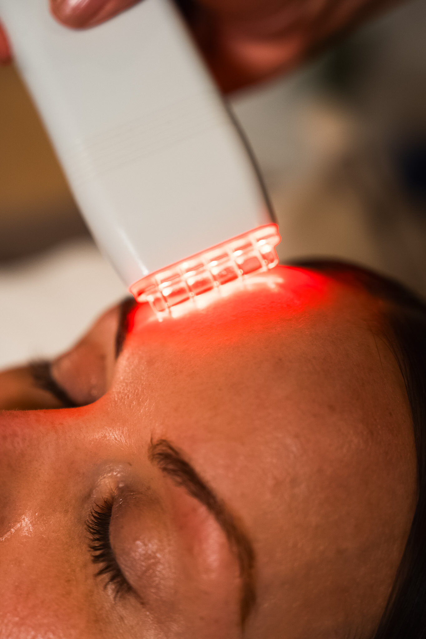 Guest receiving a Red Light Treatment or LED Facial.