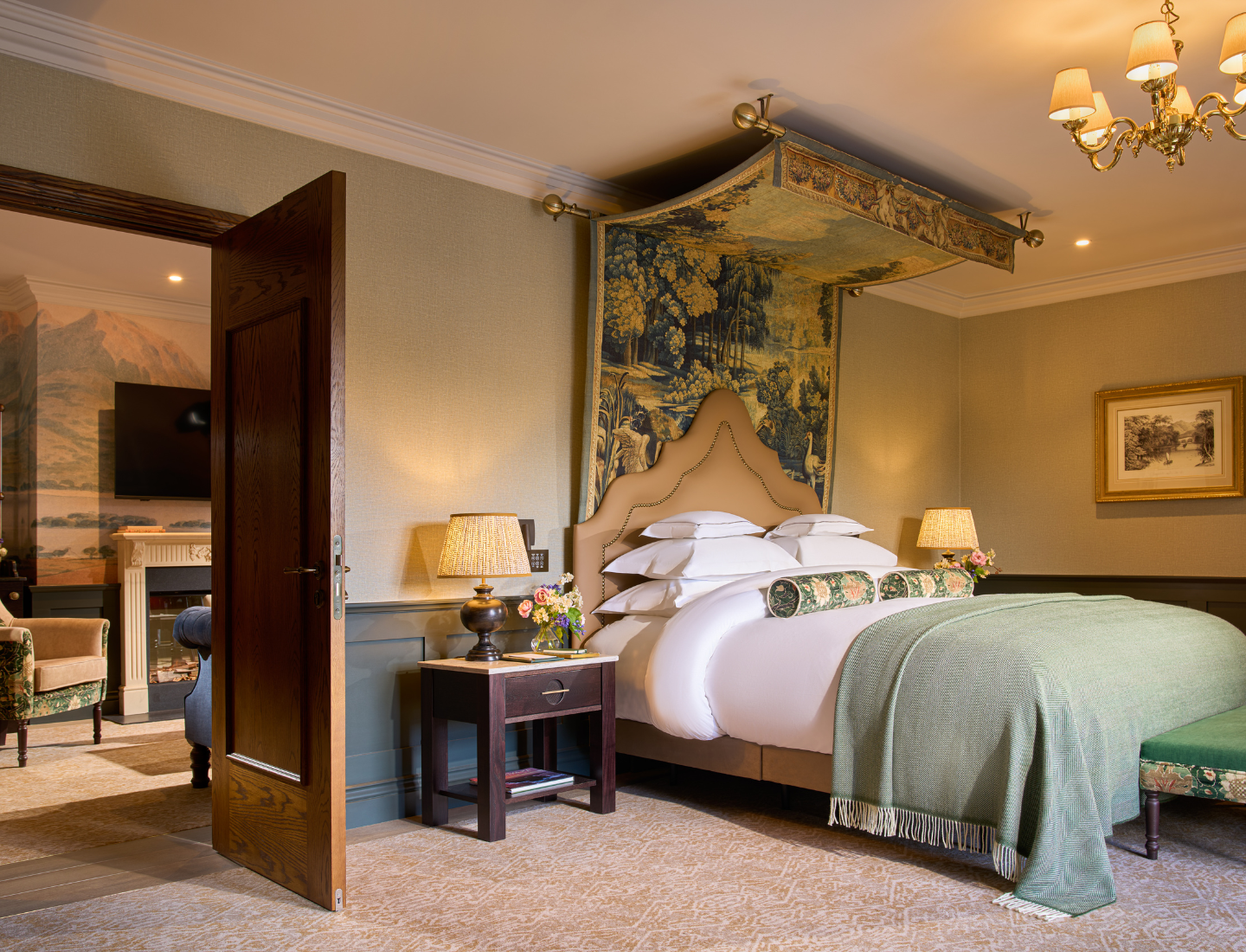 The living area and one bedroom in One Bedroom Suite.